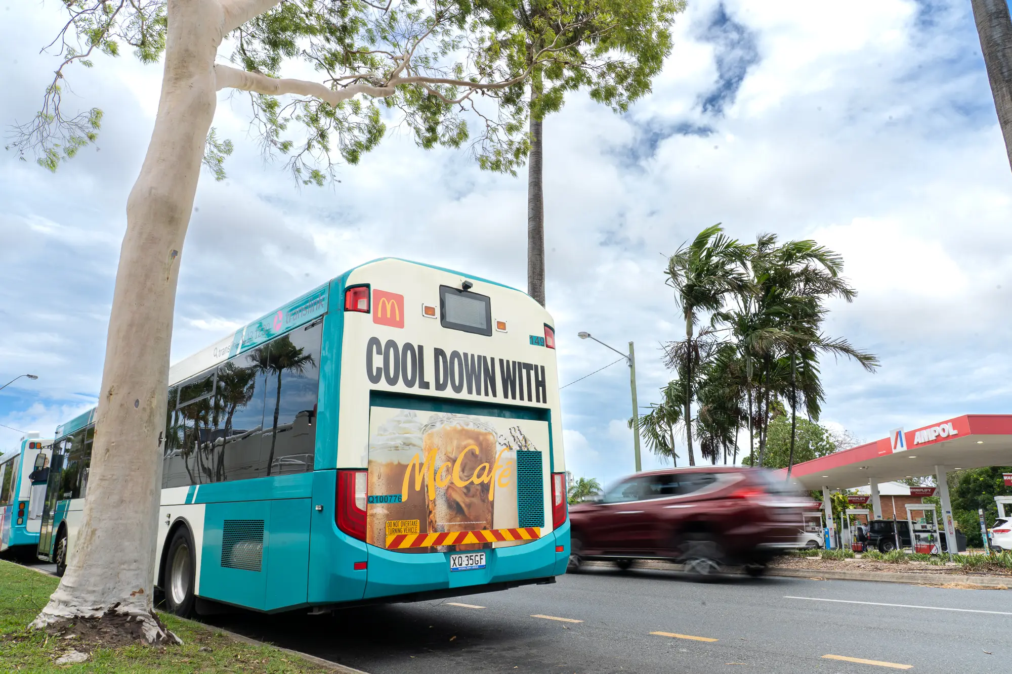 Bus advertising campaign for Chemist Warehouse travelling through Hobart CBD with pedestrians and the historic General Post Office clock tower in the background.