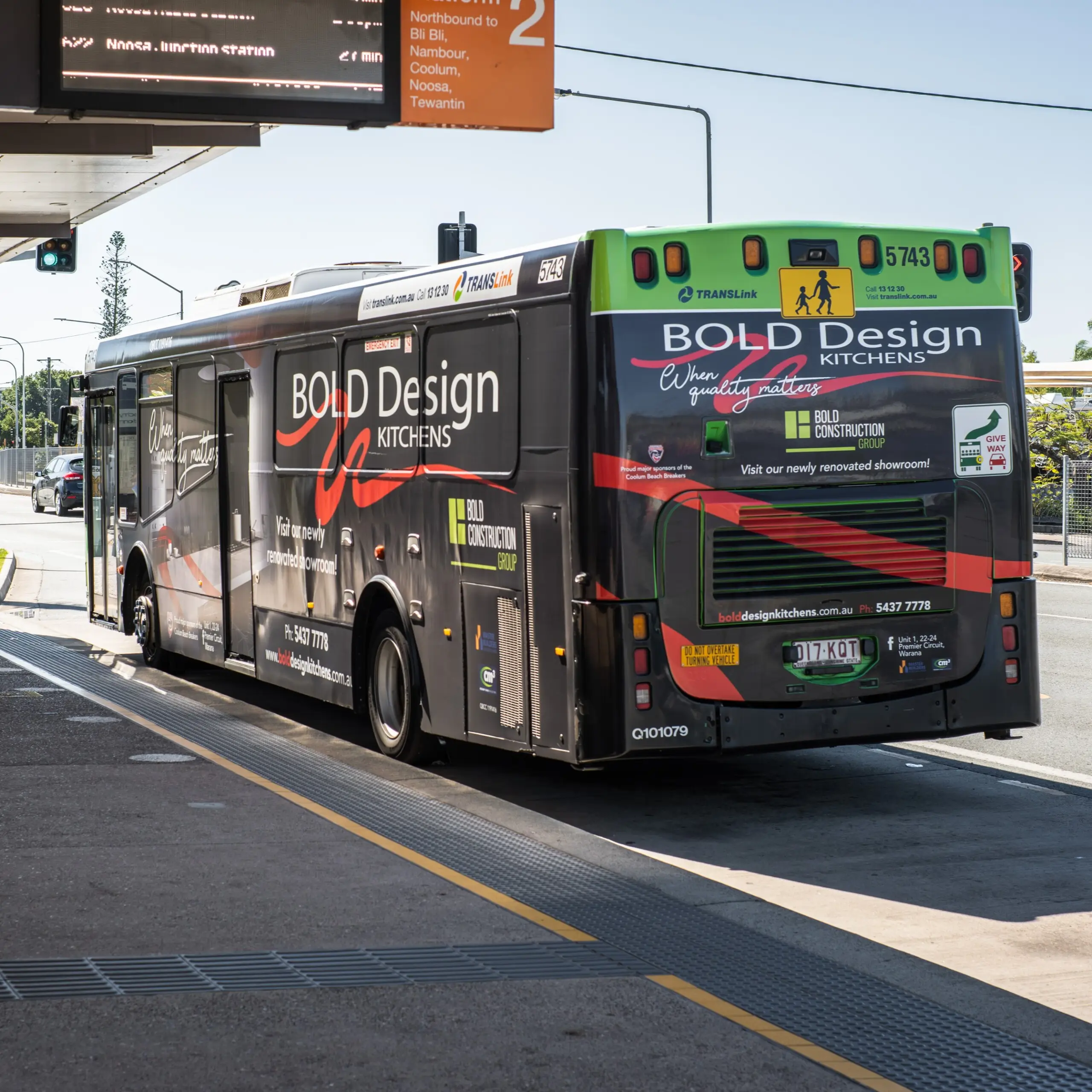 Full Wrap bus advertising for Bold Design Kitchens on a TransLink bus at a station, showing branded side and rear panels.