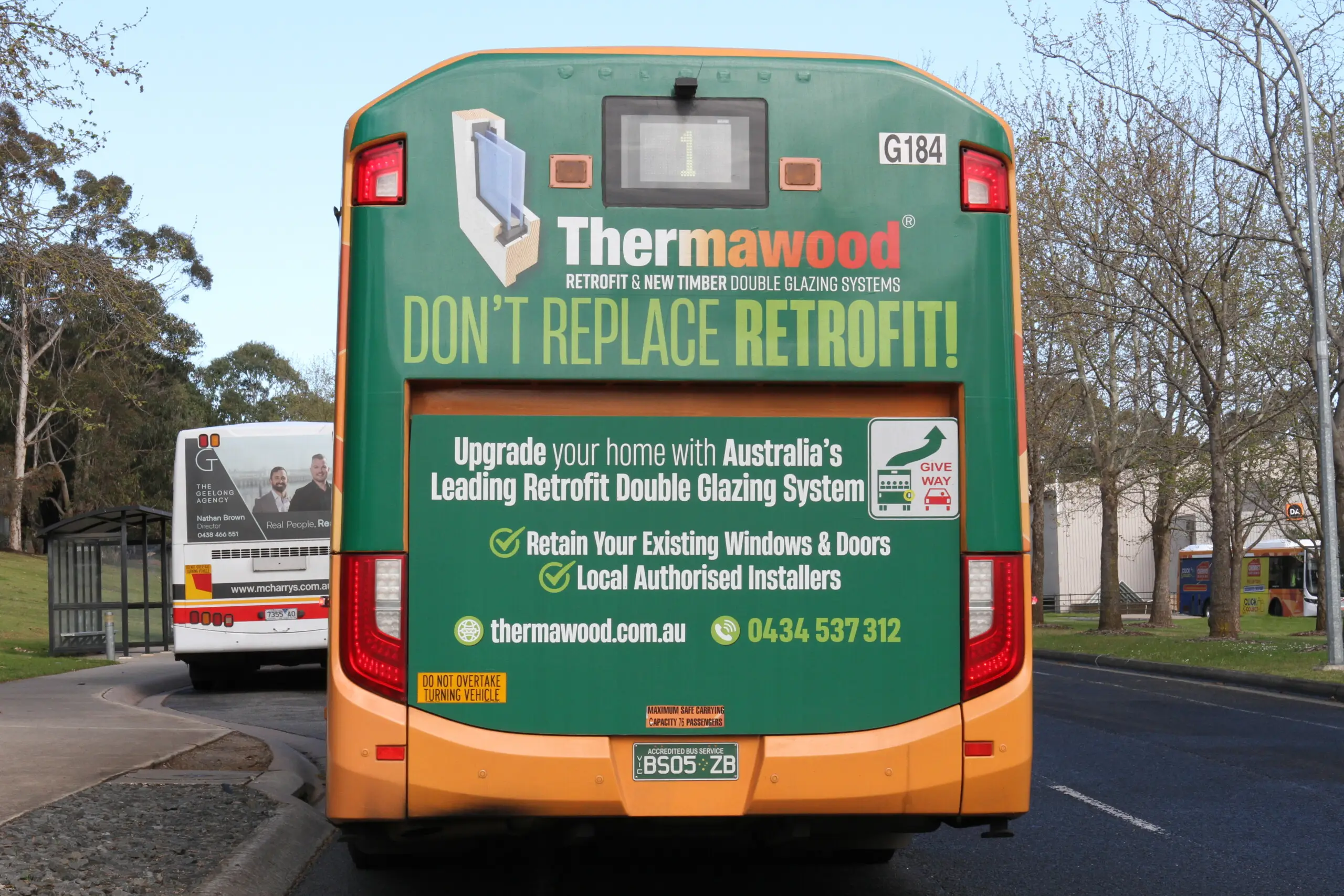 Full back bus transit advertising panel promoting home retrofit services on a city bus.